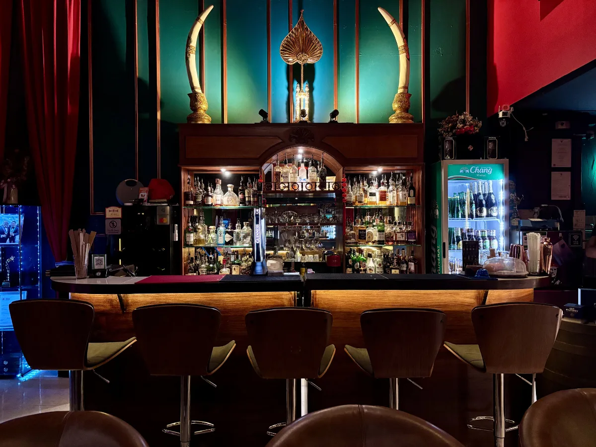 CNX Cigars bar with teal and gold decor, elephant tusks, Nimman Chiang Mai