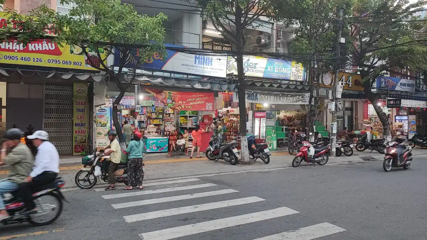 Da Nang local street with shops and motorbikes in the downtown area