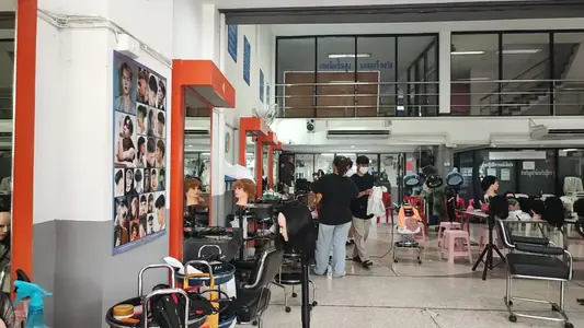 Khun Joe School interior workspace with students and trainers working
